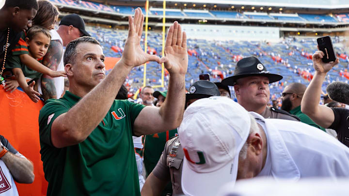 Aug 31, 2024; Gainesville, Florida, USA; Miami Hurricanes head coach Mario Cristobal gestures after a game against the Florida Gators at Ben Hill Griffin Stadium. Mandatory Credit: Matt Pendleton-Imagn Images