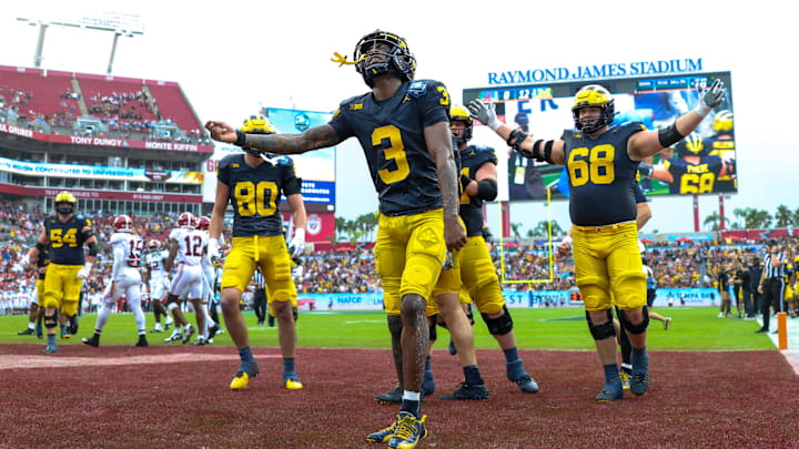  Michigan Wolverines wide receiver Fredrick Moore celebrates after scoring a touchdown against the Alabama Crimson Tide in the ReliaQuest Bowl.