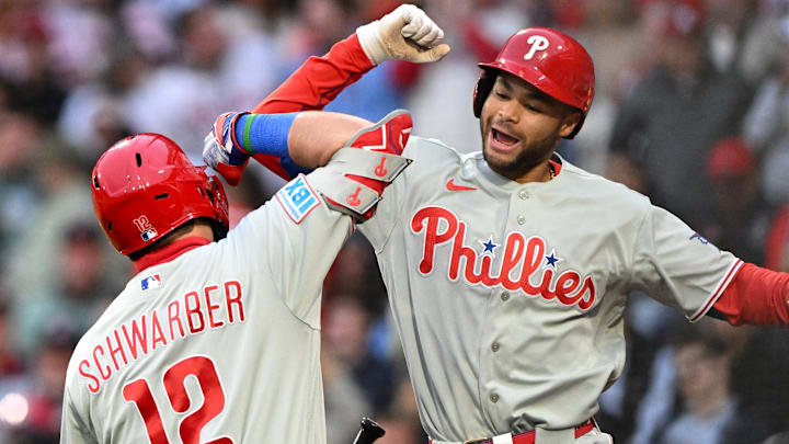 May 13, 2026; Boston, Massachusetts, USA; Philadelphia Phillies center fielder Justin Crawford (2) reacts with left fielder Kyle Schwarber (12) after hitting a solo home run against the Boston Red Sox during the third inning at Fenway Park.