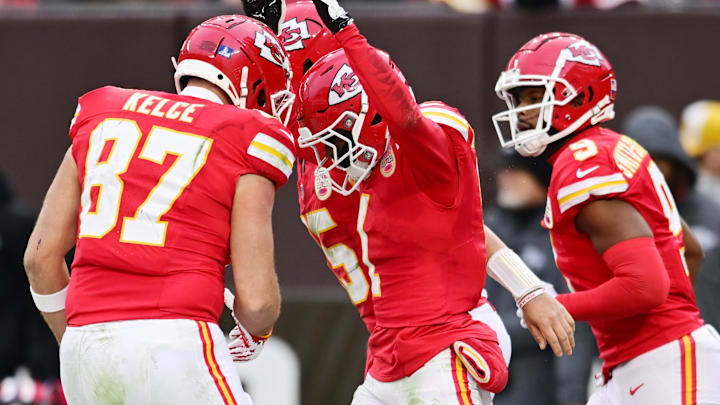Dec 15, 2024; Cleveland, Ohio, USA; Kansas City Chiefs wide receiver Xavier Worthy (1) celebrates with tight end Travis Kelce (87) and wide receiver JuJu Smith-Schuster (9) after scoring a touchdown during the second half against the Cleveland Browns at Huntington Bank Field. Mandatory Credit: Ken Blaze-Imagn Images