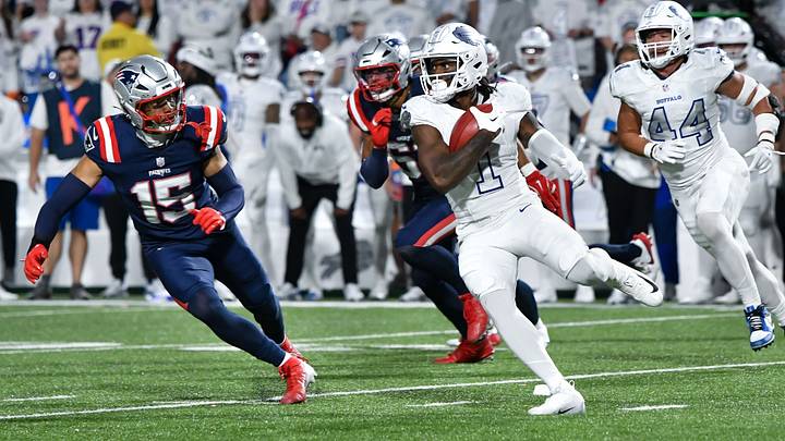 Buffalo Bills wide receiver Curtis Samuel (1) returns a punt with New England Patriots linebacker Marte Mapu (15) looking to make a tackle in the fourth quarter at Highmark Stadium. Buffalo Bills wide receiver Curtis Samuel (1) returns a punt with New England Patriots linebacker Marte Mapu (15) looking to make a tackle in the fourth quarter at Highmark Stadium.
