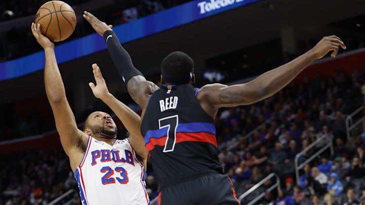 Nov 30, 2024; Detroit, Michigan, USA;  Detroit Pistons guard Jaden Ivey (23) shoots on Detroit Pistons forward Paul Reed (7) in the first half at Little Caesars Arena. Mandatory Credit: Rick Osentoski-Imagn Images
