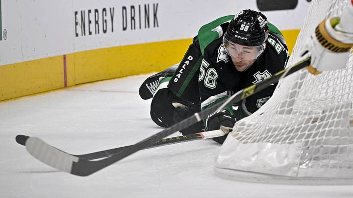 Mar 22, 2026; Dallas, Texas, USA; Dallas Stars left wing Michael Bunting (58) dives for the puck during the second period against the Vegas Golden Knights at the American Airlines Center. Mandatory Credit: Jerome Miron-Imagn Images