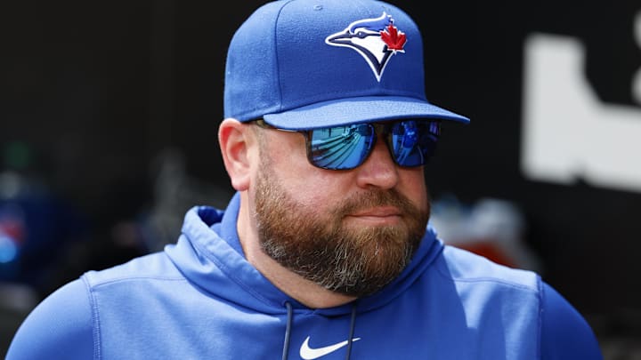 Apr 3, 2026; Chicago, Illinois, USA; Toronto Blue Jays manager John Schneider looks on from the dugout before a baseball game against the Chicago White Sox at Rate Field.