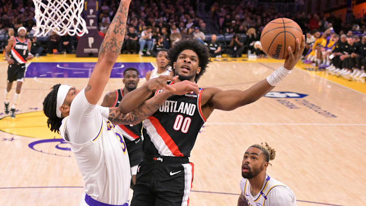 Dec 8, 2024; Los Angeles, California, USA; Los Angeles Lakers forward Anthony Davis (3) defends a shot by Portland Trail Blazers guard Scoot Henderson (00) in the first half at Crypto.com Arena. Mandatory Credit: Jayne Kamin-Oncea-Imagn Images Dec 8, 2024; Los Angeles, California, USA; Los Angeles Lakers forward Anthony Davis (3) defends a shot by Portland Trail Blazers guard Scoot Henderson (00) in the first half at Crypto.com Arena. Mandatory Credit: Jayne Kamin-Oncea-Imagn Images