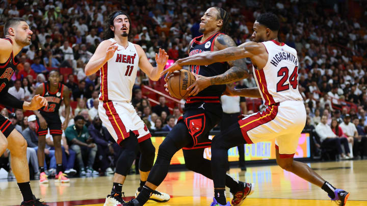 Apr 19, 2024; Miami, Florida, USA; Chicago Bulls forward DeMar DeRozan (11) drives to the basket past Miami Heat forward Haywood Highsmith (24) in the second quarter during a play-in game of the 2024 NBA playoffs at Kaseya Center. Mandatory Credit: Sam Navarro-USA TODAY Sports