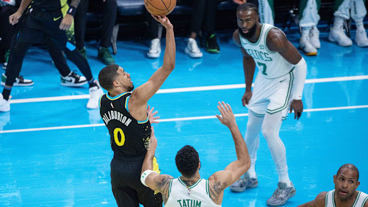 Dec 4, 2023; Indianapolis, Indiana, USA; Indiana Pacers guard Tyrese Haliburton (0) shoots while