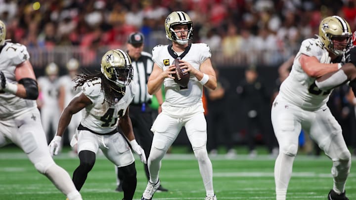 Sep 29, 2024; Atlanta, Georgia, USA; New Orleans Saints quarterback Derek Carr (4) drops back to pass against the Atlanta Falcons in the fourth quarter at Mercedes-Benz Stadium. Mandatory Credit: Brett Davis-Imagn Images