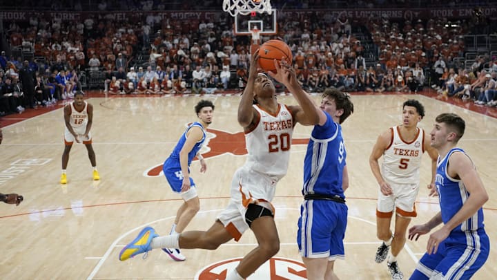 Feb 15, 2025; Austin, Texas, USA; Texas Longhorns guard Tre Johnson (20) drives to the basket against Kentucky Wildcats forward Trent Noah (9) during the second half at Moody Center. Mandatory Credit: Scott Wachter-Imagn Images