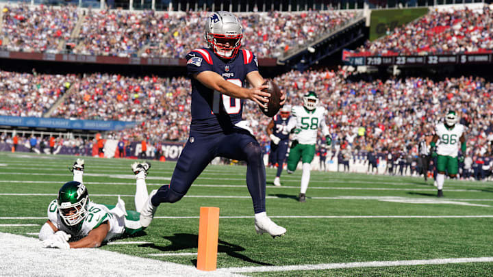 Oct 27, 2024; Foxborough, Massachusetts, USA; New England Patriots quarterback Drake Maye (10) runs the ball for a touchdown against the New York Jets in the first quarter at Gillette Stadium. Mandatory Credit: David Butler II-Imagn Images Oct 27, 2024; Foxborough, Massachusetts, USA; New England Patriots quarterback Drake Maye (10) runs the ball for a touchdown against the New York Jets in the first quarter at Gillette Stadium. Mandatory Credit: David Butler II-Imagn Images