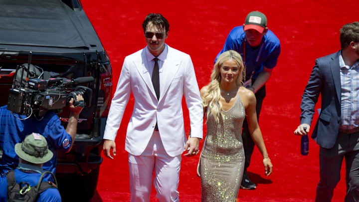 Jul 16, 2024; Arlington, Texas, USA; National League pitcher Paul Skenes of the Pittsburgh Pirates walks the red carpet with his girlfriend LSU gymnast Olivia Livvy Dunne before the 2024 MLB All-Star game at Globe Life Field. Mandatory Credit: Jerome Miron-Imagn Images