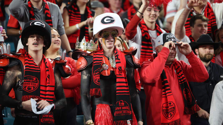 Dec 30, 2023; Miami Gardens, FL, USA; Georgia Bulldogs fans react after defeating the Florida State Seminoles in the 2023 Orange Bowl at Hard Rock Stadium. Mandatory Credit: Nathan Ray Seebeck-USA TODAY Sports