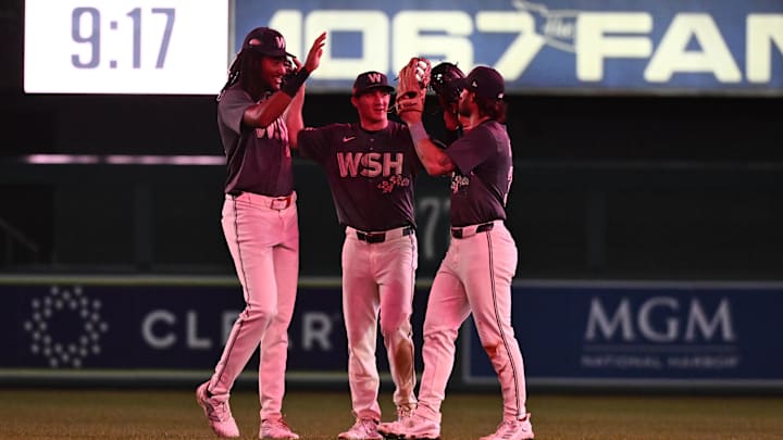 Sep 27, 2024; Washington, District of Columbia, USA;  Washington Nationals outfielders James Wood (29) and Jacob Young (30) and Dylan Crews (3) celebrate a victory against the Philadelphia Phillies at Nationals Park. Mandatory Credit: James A. Pittman-Imagn Images