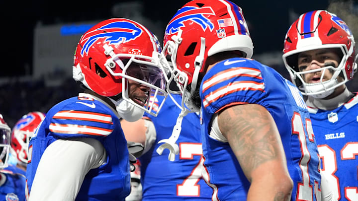 Buffalo Bills wide receiver Gabe Davis (13) celebrates with wide receiver Joshua Palmer (5) after scoring a touchdown against the New York Jets during the third quarter at Highmark Stadium. Buffalo Bills wide receiver Gabe Davis (13) celebrates with wide receiver Joshua Palmer (5) after scoring a touchdown against the New York Jets during the third quarter at Highmark Stadium.