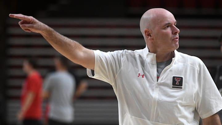 Texas Tech's assistant men's basketball coach Dave Smart gives instructions during the team's first