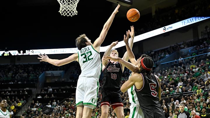 Mar 4, 2025; Eugene, Oregon, USA; Oregon Ducks center Nate Bittle (32) blocks a shot by Indiana Hoosiers forward Luke Goode (10) during the second half at Matthew Knight Arena. Mandatory Credit: Craig Strobeck-Imagn Images