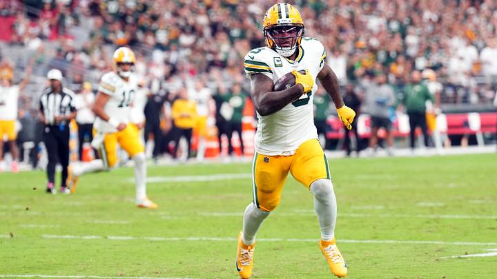 Oct 19, 2025; Glendale, Arizona, USA; Green Bay Packers running back Josh Jacobs (8) runs for a touchdown against the Arizona Cardinals during the second half at State Farm Stadium. 