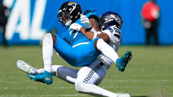 Jacksonville Jaguars wide receiver Brian Thomas Jr. (7) is tackled by Seattle Seahawks safety Nick Emmanwori (3) during the fourth quarter of an NFL football matchup, Sunday, Oct. 12, 2025, at EverBank Stadium in Jacksonville, Fla. The Seahawks defeated the Jaguars 20-12. Jacksonville Jaguars wide receiver Brian Thomas Jr. (7) is tackled by Seattle Seahawks safety Nick Emmanwori (3) during the fourth quarter of an NFL football matchup, Sunday, Oct. 12, 2025, at EverBank Stadium in Jacksonville, Fla. The Seahawks defeated the Jaguars 20-12.