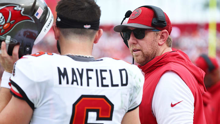 Tampa Bay offensive coordinator Liam Coen talks it over with Baker Mayfield during their run to first in the NFC South.