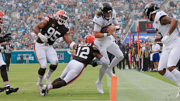 Jacksonville Jaguars quarterback Trevor Lawrence (16) is shoved out of bounds shy of the goal line by Cleveland Browns safety Rodney McLeod Jr. (12) during the second quarter of an NFL football matchup Sunday, Sept. 15, 2024 at EverBank Stadium in Jacksonville, Fla. The Browns defeated the Jaguars 18-13. [Corey Perrine/Florida Times-Union]