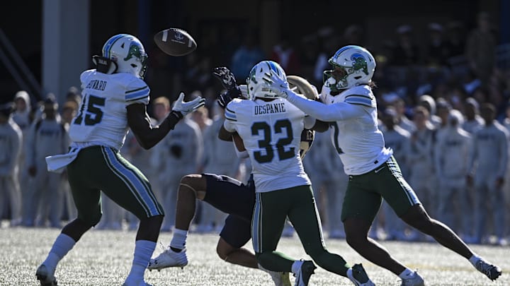 Nov 16, 2024; Annapolis, Maryland, USA;  Tulane Green Wave linebacker Sam Howard (15) catches a Navy Midshipmen tipped pass for a interception during the first half at Navy-Marine Corps Memorial Stadium.