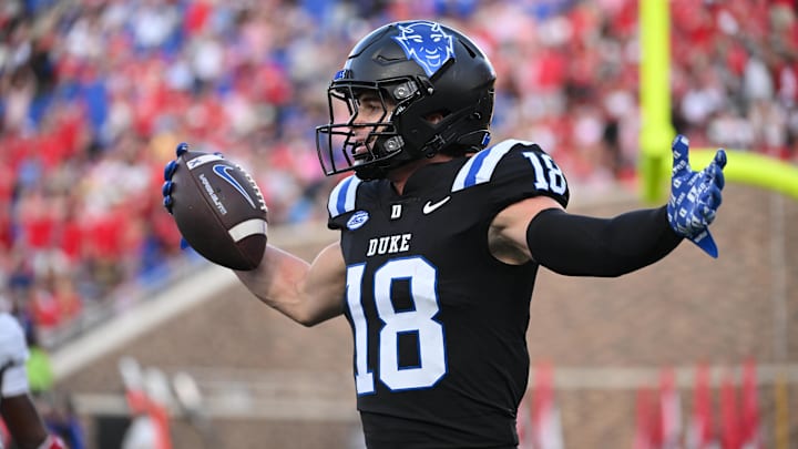 Sep 20, 2025; Durham, North Carolina, USA; Duke Blue Devils wide receiver Cooper Barkate (18) celebrates a touchdown during the third quarter against the NC State Wolfpack at Wallace Wade Stadium. Mandatory Credit: Zachary Taft-Imagn Images Sep 20, 2025; Durham, North Carolina, USA; Duke Blue Devils wide receiver Cooper Barkate (18) celebrates a touchdown during the third quarter against the NC State Wolfpack at Wallace Wade Stadium. Mandatory Credit: Zachary Taft-Imagn Images
