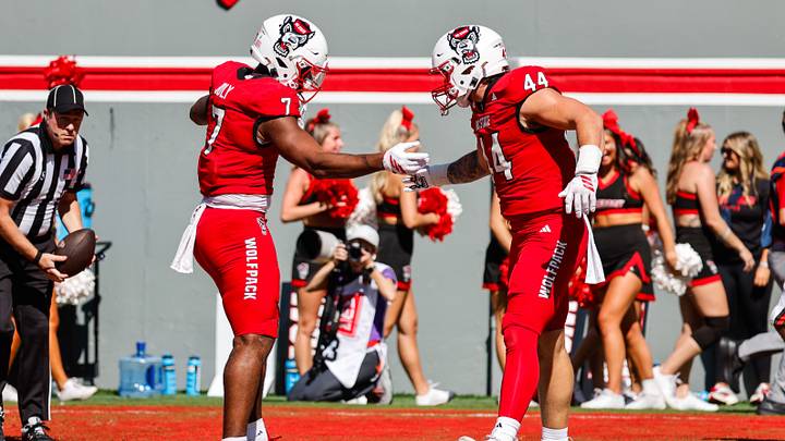 Oct 4, 2025; Raleigh, North Carolina, USA;  NC State Wolfpack tight end Justin Joly (7) and tight end Cody Hardy (44) celebrate a touchdown during the first half of the game against Campbell Fighting Camels at Carter-Finley Stadium. Mandatory Credit: Jaylynn Nash-Imagn Images