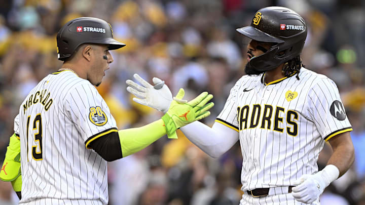 Strauss logo on the helmets of San Diego Padres stars Manny Machado and Fernando Tatis Jr. 