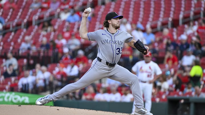 Aug 11, 2025; St. Louis, Missouri, USA;  Colorado Rockies starting pitcher Chase Dollander (32) pitches against the St. Louis Cardinals during the first inning at Busch Stadium. 