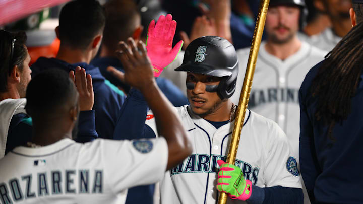 Sep 27, 2025; Seattle, Washington, USA; Seattle Mariners second baseman Jorge Polanco (7) celebrates in the dugout after hitting a 3-run home run against the Los Angeles Dodgers during the fifth inning at T-Mobile Park. Mandatory Credit: Steven Bisig-Imagn Images Sep 27, 2025; Seattle, Washington, USA; Seattle Mariners second baseman Jorge Polanco (7) celebrates in the dugout after hitting a 3-run home run against the Los Angeles Dodgers during the fifth inning at T-Mobile Park. Mandatory Credit: Steven Bisig-Imagn Images