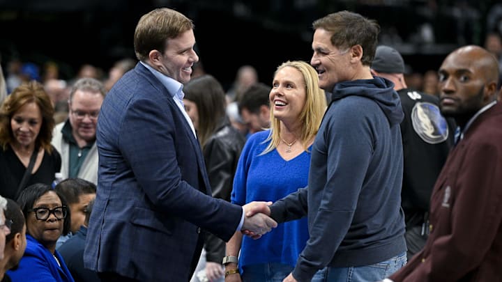 Feb 12, 2024; Dallas, Texas, USA; Dallas Mavericks governor Patrick Dumont (left) talks with Mark Cuban (right) during the first quarter of the game between the Mavericks and the Washington Wizards at the American Airlines Center. Mandatory Credit: Jerome Miron-Imagn Images