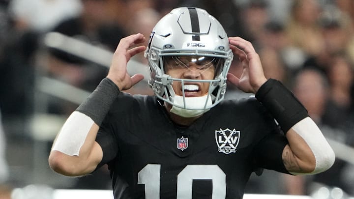 Oct 27, 2024; Paradise, Nevada, USA; Las Vegas Raiders quarterback Desmond Ridder (10) prepares to take the snap against the Kansas City Chiefs in the second half at Allegiant Stadium. Mandatory Credit: Kirby Lee-Imagn Images