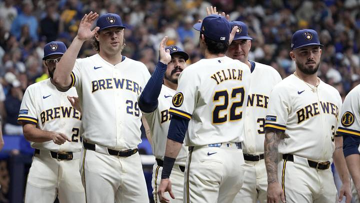 Oct 11, 2026; Milwaukee, Wisconsin, USA; Milwaukee Brewers pitcher Trevor Megill (29) high-fives designated hitter Christian Yelich (22) prior to game one of the NLCS for the 2026 MLB Playoffs against the Los Angeles Dodgers at American Family Field. Mandatory Credit: Michael McLoone-Imagn Images Oct 11, 2026; Milwaukee, Wisconsin, USA; Milwaukee Brewers pitcher Trevor Megill (29) high-fives designated hitter Christian Yelich (22) prior to game one of the NLCS for the 2026 MLB Playoffs against the Los Angeles Dodgers at American Family Field. Mandatory Credit: Michael McLoone-Imagn Images