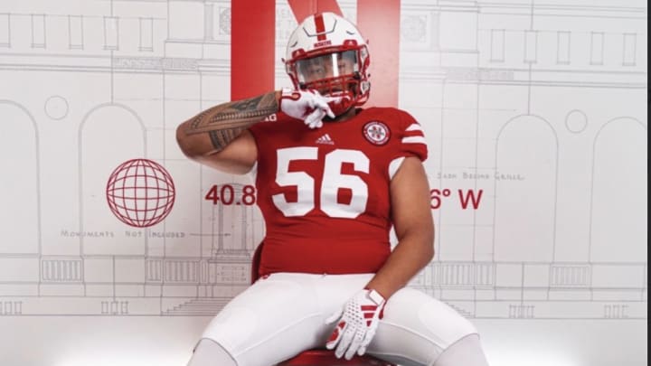 Houston Kaahaaina-Torres wearing a Nebraska uniform in his commitment announcement.