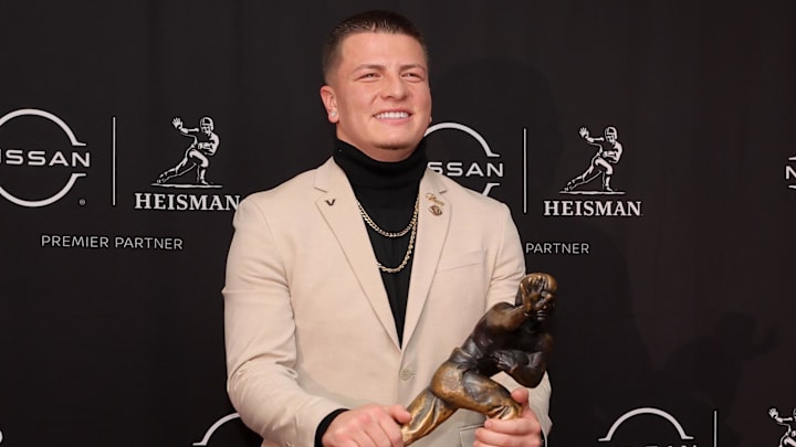 Dec 13, 2025; New York, NY, USA; Vanderbilt Commodores quarterback Diego Pavia poses with the Heisman trophy during a press conference at the New York Marriott Marquis. Mandatory Credit: Brad Penner-Imagn Images