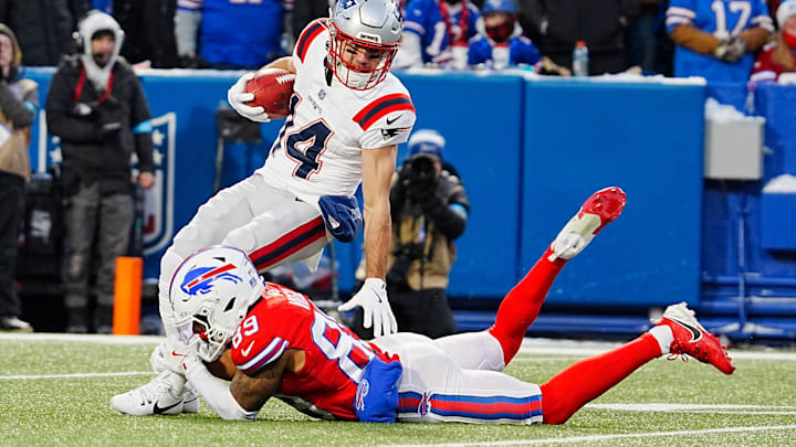 Buffalo Bills Jalen Virgil tackles Alex Erickson keeping him from gaining any yards on the punt return New England Patriots during first half action at Highmark Stadium where the Buffalo Bills hosted the New England Patriots in Orchard Park on Dec. 22, 2024.