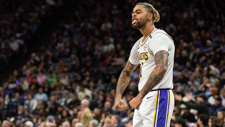Dec 21, 2024; Sacramento, California, USA; Los Angeles Lakers guard D'Angelo Russell (1) flexes after scoring against the Sacramento Kings during the fourth quarter at Golden 1 Center. Mandatory Credit: Ed Szczepanski-Imagn Images