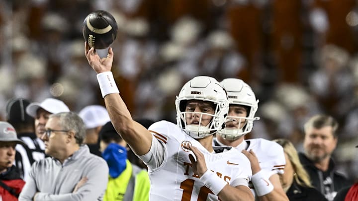 Nov 30, 2024; College Station, Texas, USA; Texas Longhorns quarterback Arch Manning (16) warms up prior to the game Texas A&M Aggies at Kyle Field. Mandatory Credit: Maria Lysaker-Imagn Images 