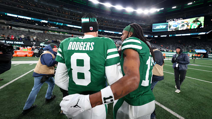 Jan 5, 2025; East Rutherford, New Jersey, USA; New York Jets quarterback Aaron Rodgers (8) and wide receiver Davante Adams (17) walk on the field after the Jets win over the Miami Dolphins at MetLife Stadium. Mandatory Credit: Ed Mulholland-Imagn Images Jan 5, 2025; East Rutherford, New Jersey, USA; New York Jets quarterback Aaron Rodgers (8) and wide receiver Davante Adams (17) walk on the field after the Jets win over the Miami Dolphins at MetLife Stadium. Mandatory Credit: Ed Mulholland-Imagn Images