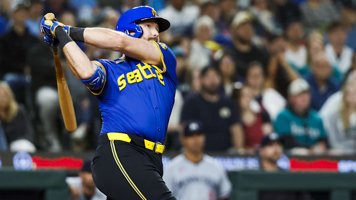 Seattle Mariners catcher Cal Raleigh hits a home run during a game against the Minnesota Twins on May 30 at T-Mobile Park.