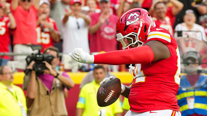 Sep 15, 2024; Kansas City, Missouri, USA; Kansas City Chiefs offensive tackle Wanya Morris (64) celebrates after scoring a touchdown during the second half against the Cincinnati Bengals at GEHA Field at Arrowhead Stadium. Mandatory Credit: Jay Biggerstaff-Imagn Images