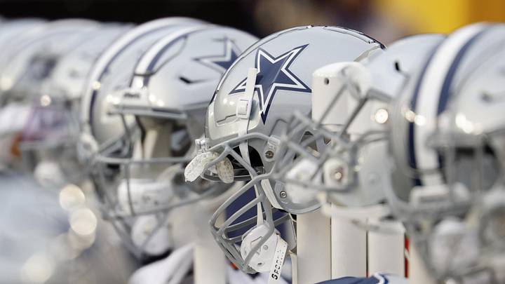 A view of Dallas Cowboys players' helmets on the bench against the Washington Commanders at FedExField. 