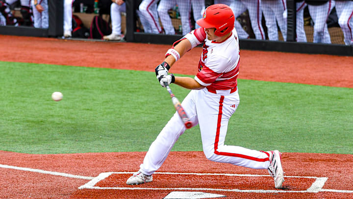 A batter for Louisville baseball swings against Notre Dame