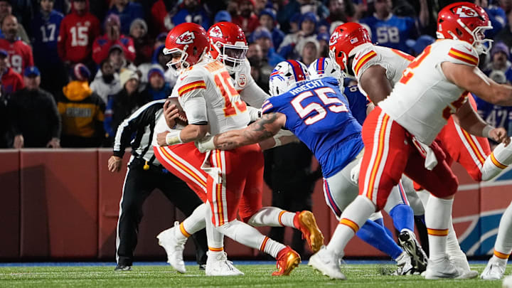 Nov 2, 2025; Orchard Park, New York, USA; Kansas City Chiefs quarterback Patrick Mahomes (15) is brought down by Buffalo Bills defensive end Michael Hoecht (55)