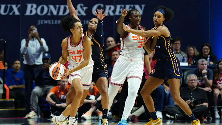 Aug 17, 2025; Uncasville, Connecticut, USA; Indiana Fever guard Odyssey Sims (1) defends against Connecticut Sun guard Leila Lacan (47) in the second half at Mohegan Sun Arena.