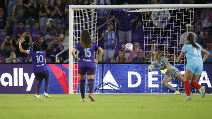 Orlando Pride forward Marta (10) shoots and scores a goal against Chicago Stars goalkeeper Alyssa Naeher from the penalty spot. 