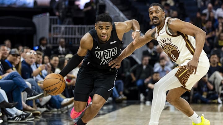 Mar 25, 2026; San Francisco, California, USA; Brooklyn Nets guard Malachi Smith (18) drives past Golden State Warriors guard De'anthony Melton (8)  during the second quarter at Chase Center. Mandatory Credit: John Hefti-Imagn Images
