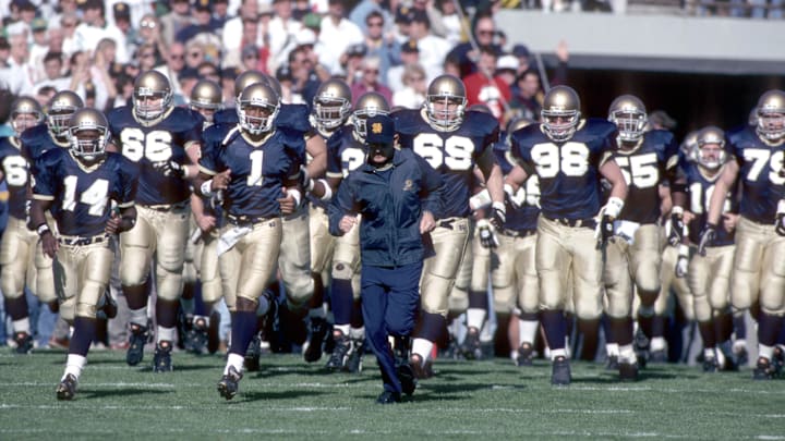 unknown date 1993; South Bend, IN, USA; FILE PHOTO; Notre Dame Irish head coach Lou Holtz leads his team onto the field during the 1993 season at Notre Dame Stadium. Mandatory Credit: Photo By Imagn Images © Copyright  Imagn Images