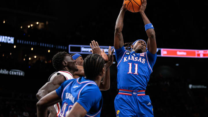 Mar 13, 2026; Kansas City, MO, USA; Kansas Jayhawks guard Jamari McDowell (11) rebounds during the first half against the Houston Cougars at T-Mobile Center. Mandatory Credit: William Purnell-Imagn Images