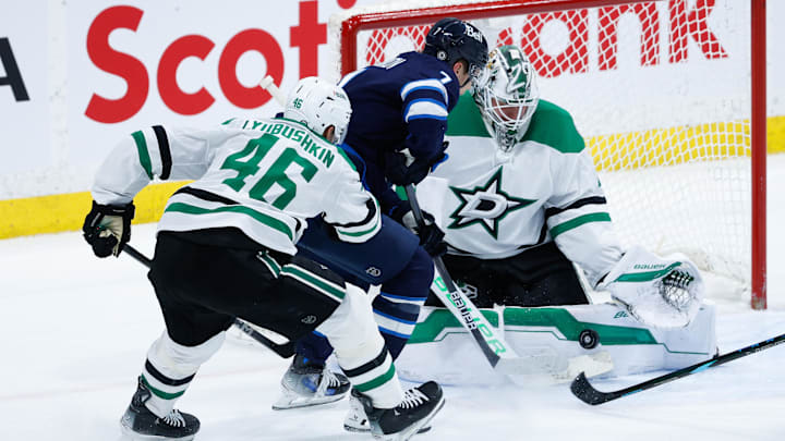 Mar 14, 2025; Winnipeg, Manitoba, CAN;  Dallas Stars goalie Jake Oettinger (29) stops Winnipeg Jets forward Vladislav Namestnikov (7) during the third period at Canada Life Centre. Mandatory Credit: Terrence Lee-Imagn Images